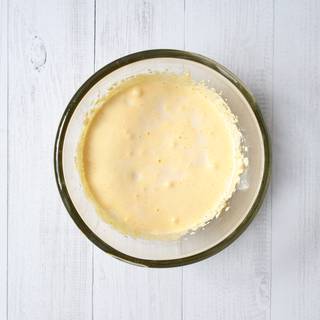 Pour milk gently, and combine it well with a handheld mixer.