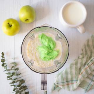 Now add the ice cream and sugar to the apple and milk mixture. Then blend them well in your blender. I used apple ice cream. At least add vanilla to your mixture