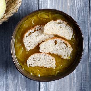 When your soup is cooked, turn on the oven to be heated. Pour the soup into a bowl and put some baguettes inside.