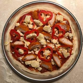 Add chopped red bell pepper and more mozzarella cheese.