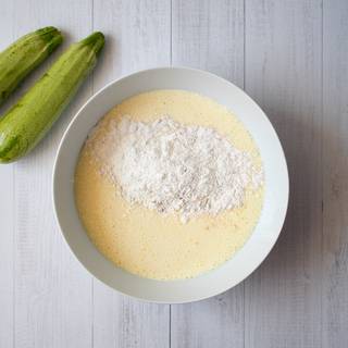 Mix flour, cinnamon, salt, and baking powder in another bowl, sift them 3 times, and then add them to your batter and whisk well.