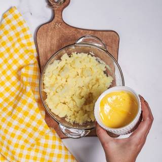 You should prepare the mashed potato after you cooked the beef. Mash the cooked potatoes and mix them with butter.