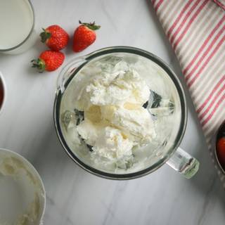 Measure the vanilla ice cream and pour it into the blender.