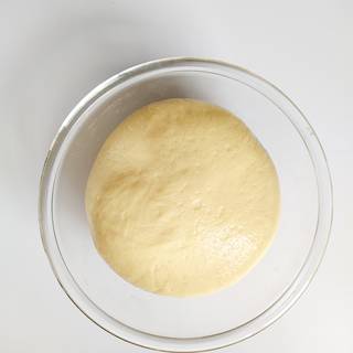 Take the dough out of the bowl and put it on an even surface.