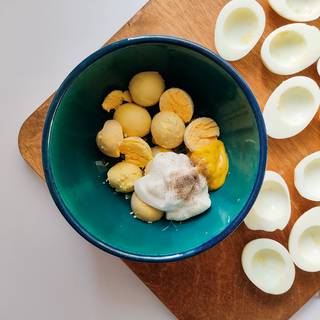 Now mix the yolks with mayonnaise, mustard, salt, and pepper.