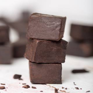 Cut the fudge with a sharp knife to any size you desire. To have cleaner cuts, you can clean the knife with a wet cloth after each cut. 