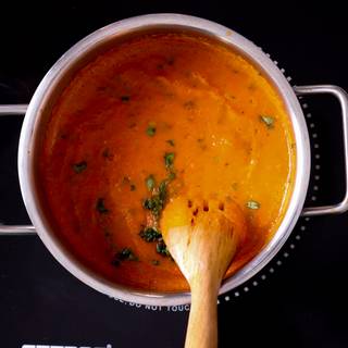 Finally, add the chopped basil to your mixture and take the soup away from the heat immediately.