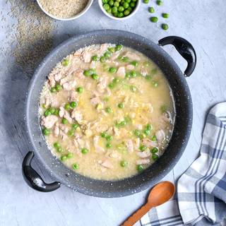 Fry the rice with the chicken well and add one cup of chicken broth. Put on the lid and wait for your rice to soften.