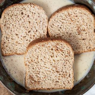 Put each piece of toast in the liquid and let it be at least a minute.