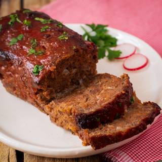 Now, remove from the oven and garnish with parsley. Let it cool before slicing, if not, it will be fall apart. 