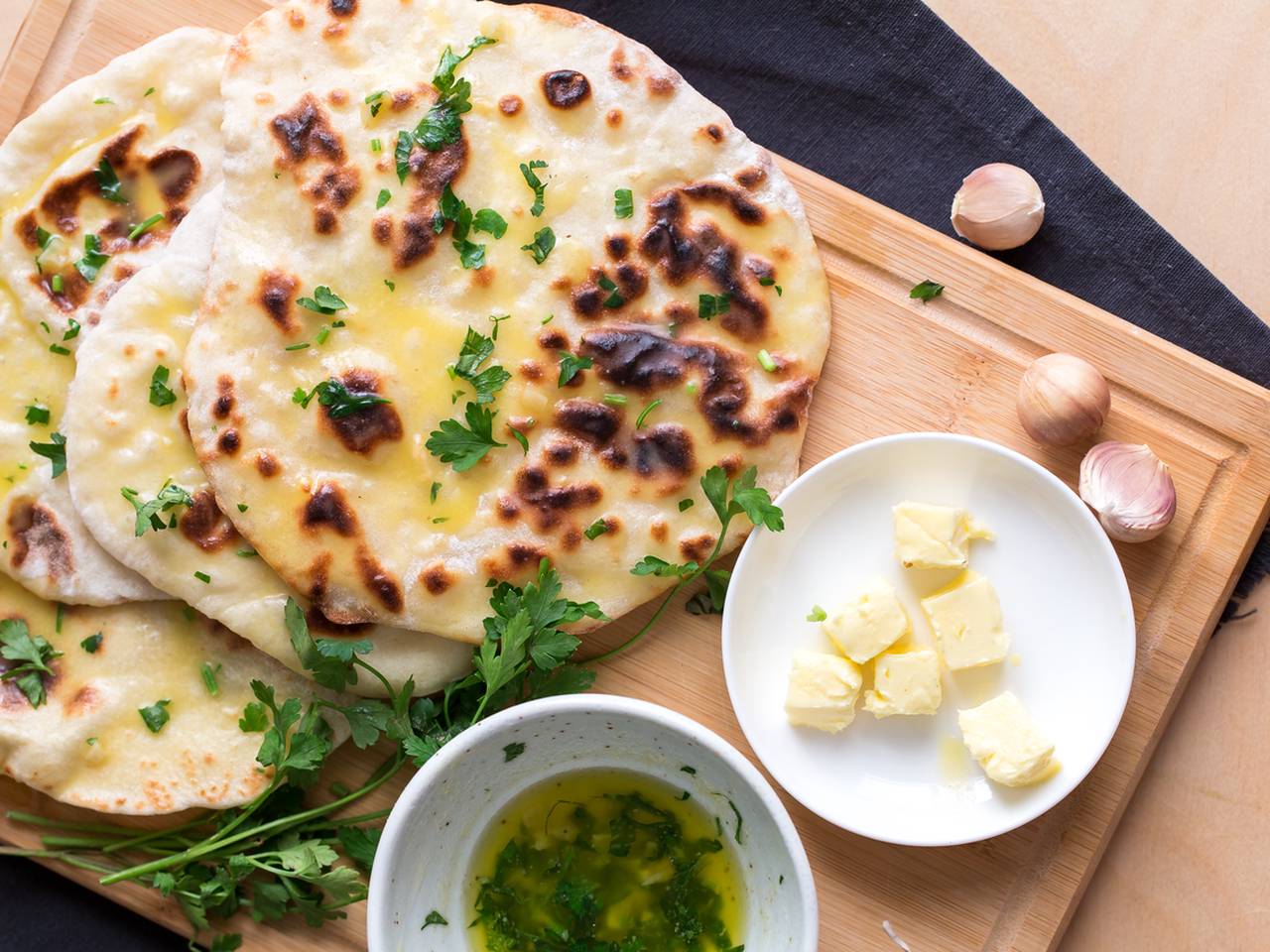 Warm Indian Garlic Naan With Pan