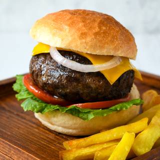 Spread your favorite sauce on the bun (ketchup, mustard, or mayonnaise) put the beef, lettuce, pickle, tomato, onion, and any other vegetables inside your bun. You can add some gouda cheese to your hot burger if you like. Your sandwich is ready.