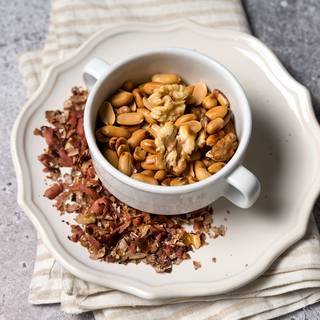 Fry the walnuts and peanuts and remove the skin as much as possible.