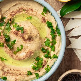 Enjoy this delicious soft hummus with some pita bread. 