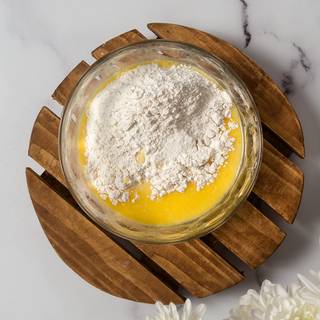 Add the flour and whisk until smooth. The batter will be thin.