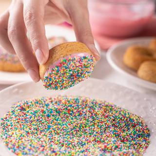 After dipping the donuts in chocolate, coat them in truffles or sprinkle some truffles on them.