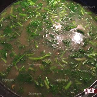 Chop the reshteh and add it to the pot. we stir it good and put the pot’s door and allow the reshteh to be baked. We can add the rest fried onions and hot garlic in the ash or keep it just for designing. 