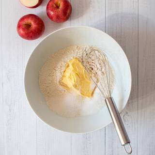 Mix flour with salt, butter, and 3 tablespoons of sugar in a big bowl.