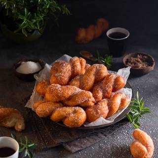 You can roll the cooled doughnuts in sugar or sugar and cinnamon mixture.