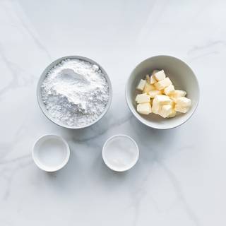 Prepare the pie crust ingredients: the flour, the cold butter, the cold water, and the sugar.