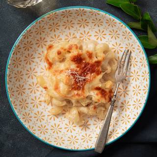 You can grate some parmesan cheese on your pasta and serve it.