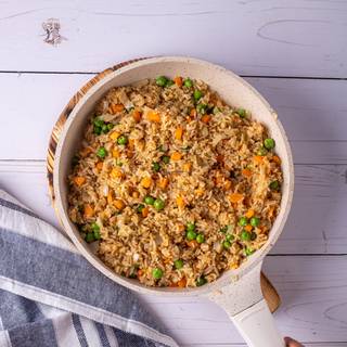 Now add the vegetables and mix them well and fry on high heat. Stir quickly until they become a little brown.