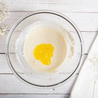 When milk is combined, melt the butter and let it cool down. Then add it to the ingredients.