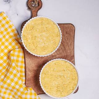 Cover the beef layer with the mashed potato. you can carve shapes on it with a fork. 