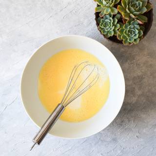 Add milk and vegetable oil or melted butter to your batter and whisk until they are mixed completely.