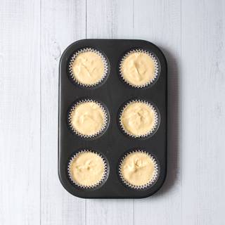 Put capsules in cupcakes' cases and fill 1\3 of the space with custard or patisserie and then put it in a pre-heated oven with 175 Fahrenheit degree.