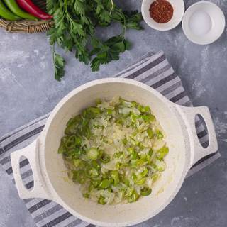 Fry the chopped chili, sweet peppers, and onions to make them soft for about 7 minutes.