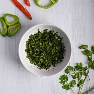 Mince fresh parsley and Coriander leaves inside the food processor.