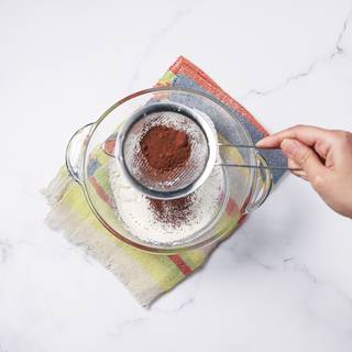 Sift cocoa powder.