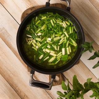 Add the spring onions after half an hour.