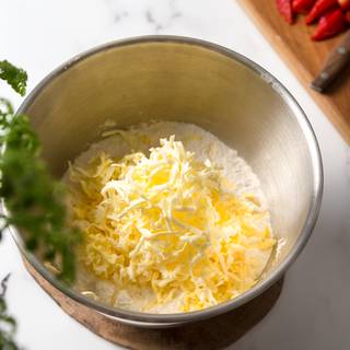 Grate the cold butter and add it to the dry ingredients and whisk well.