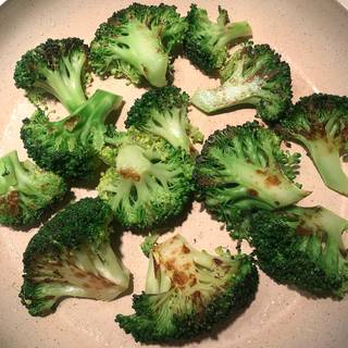 Drain the cooked broccoli and then fry them in a grease skillet for 5 minutes until golden.