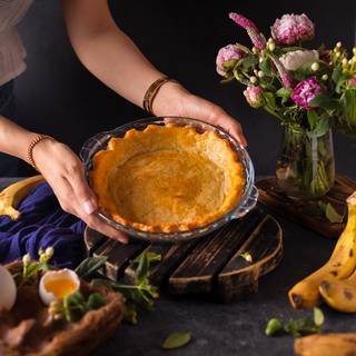 Mix the egg and butter well and cover the crust with them. Cover the edges with foil and put it inside the oven at 200C for 15 more minutes to become golden.