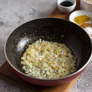 Fry the chopped onions and garlic in a pan with one tablespoon of olive oil.