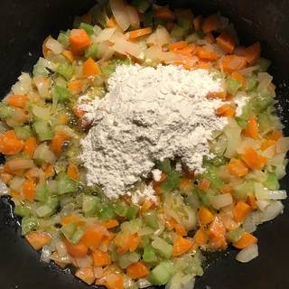 Saute the vegetable mixture for about 2 minutes more then add the flour.